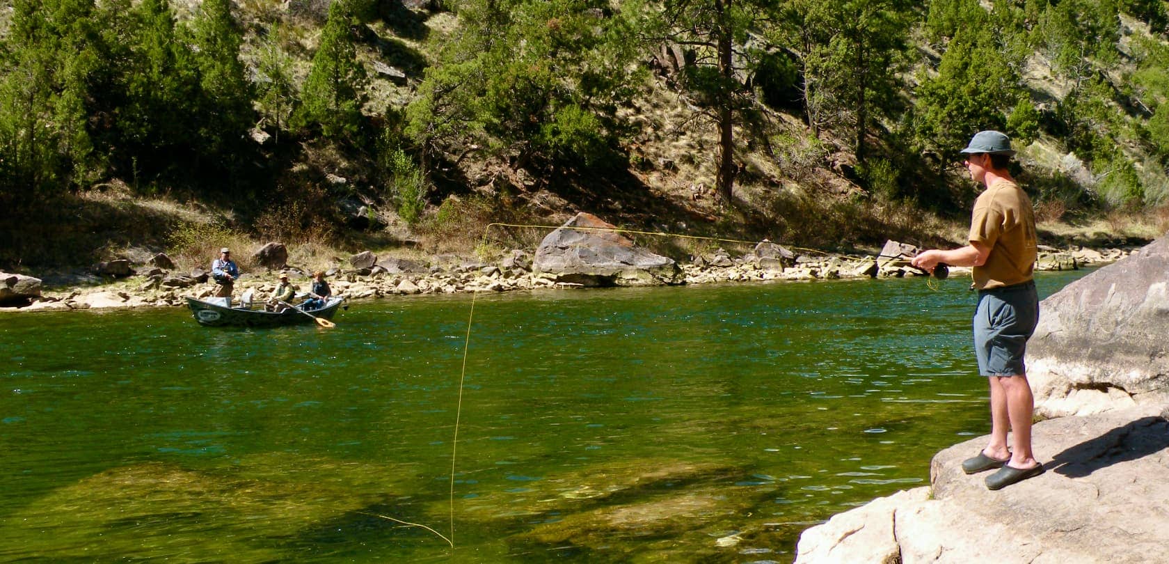 Man fishing in a river in Wyoming