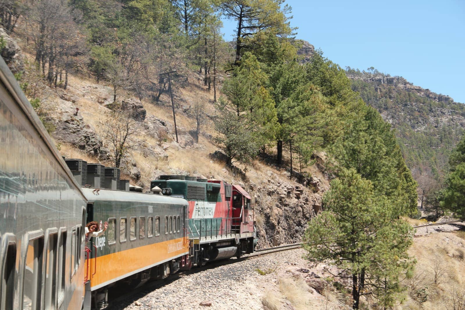 Woman waving from train in Mexico