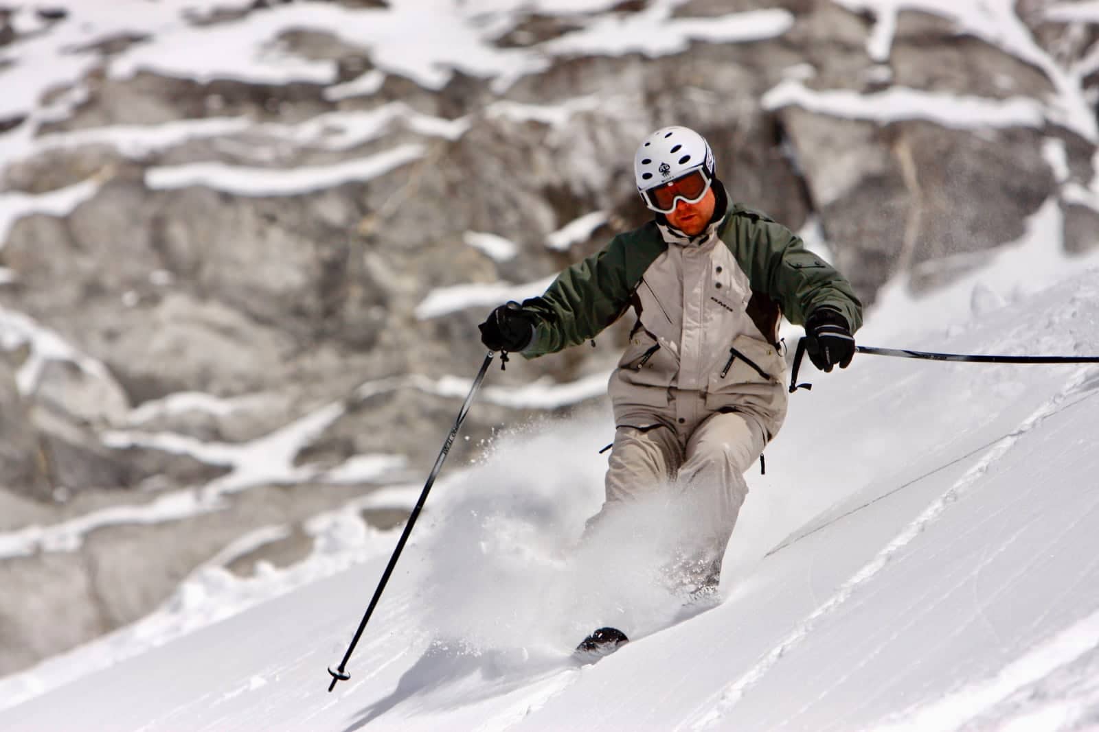 Downhill skier enjoying fresh snow on mountain