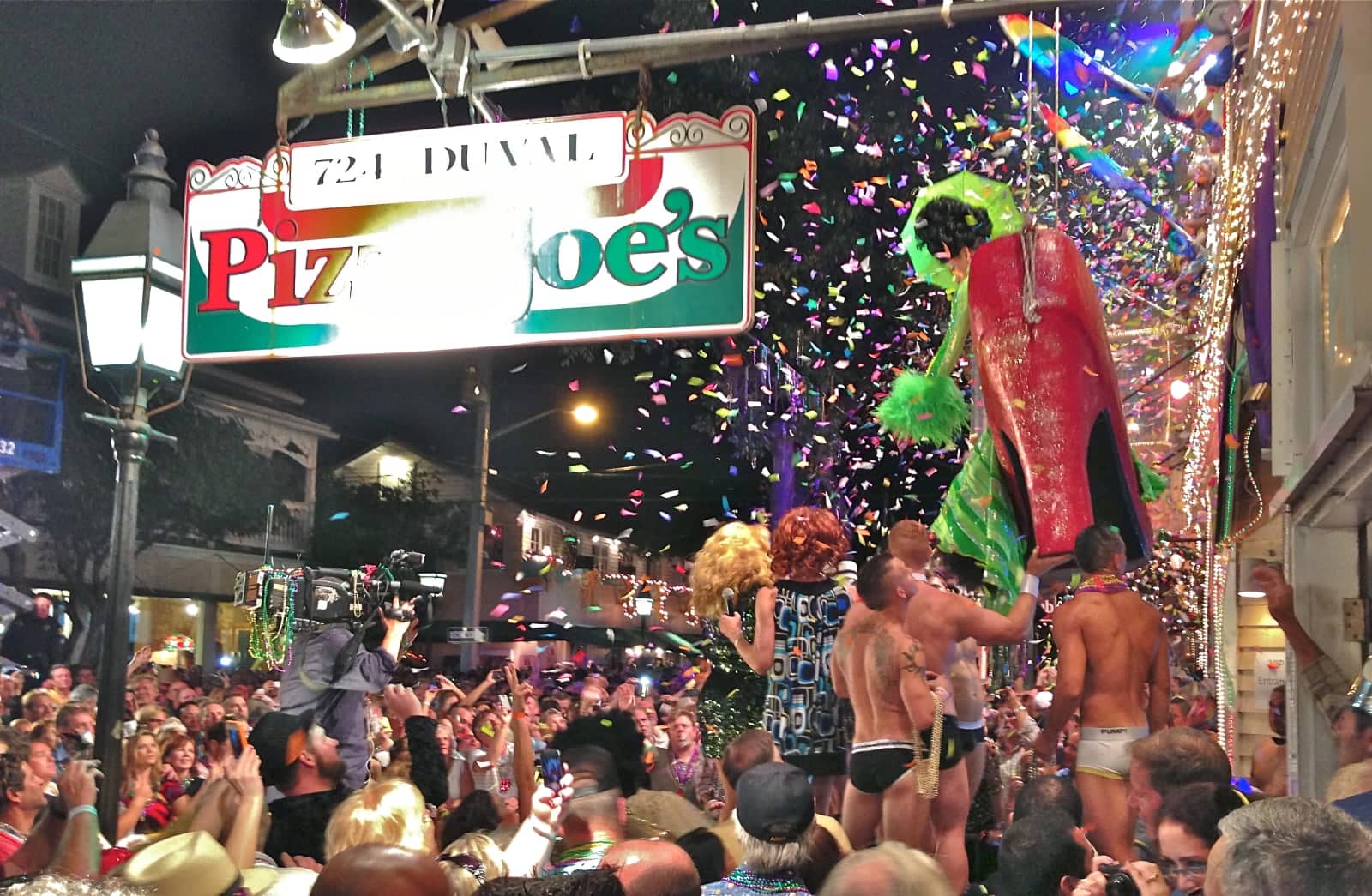 Crowd of men and women celebrating Mardi Gras in New Orleans