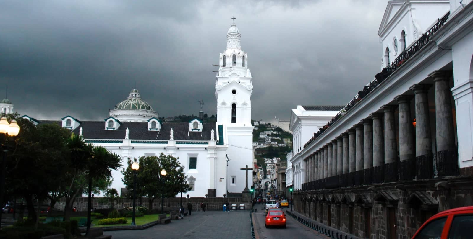 White Spanish style buildings against gloomy sky in Quito, Ecuador