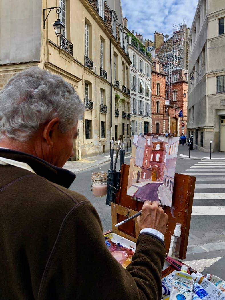 Artist painting street scene