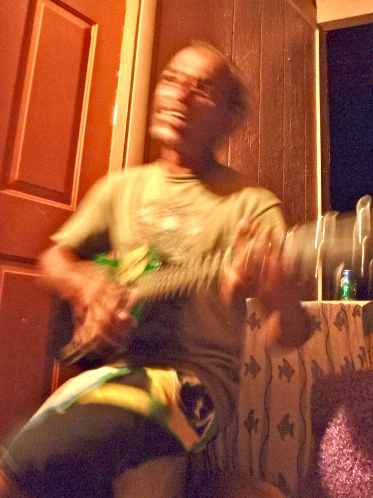 Blurry image of man playing guitar