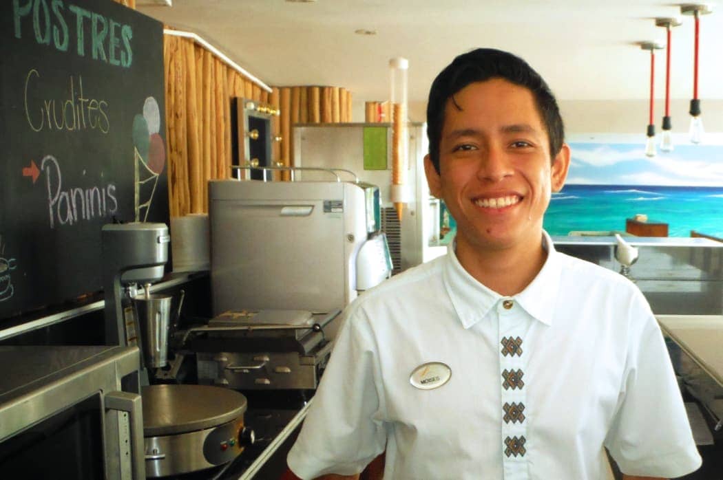 Young man in white shirt smiling