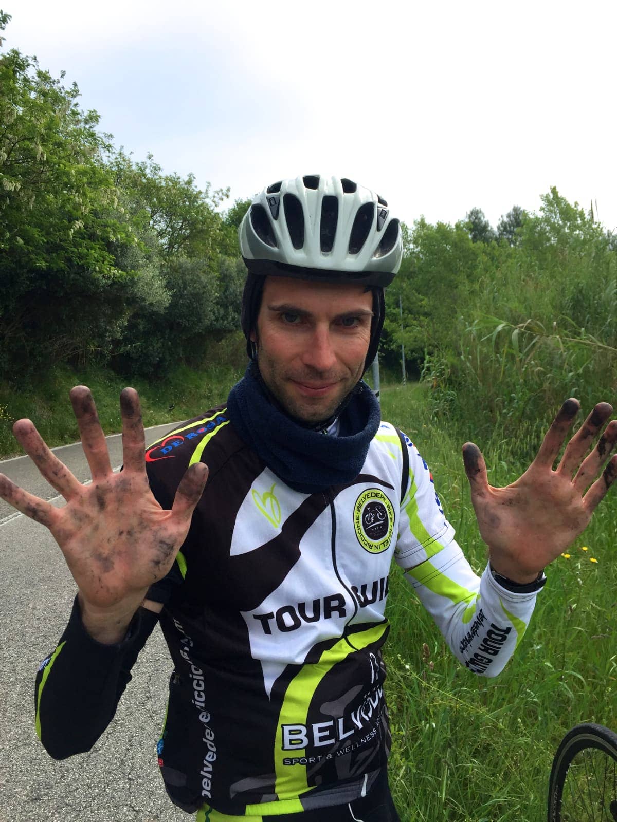 Cyclist showing dirty hands