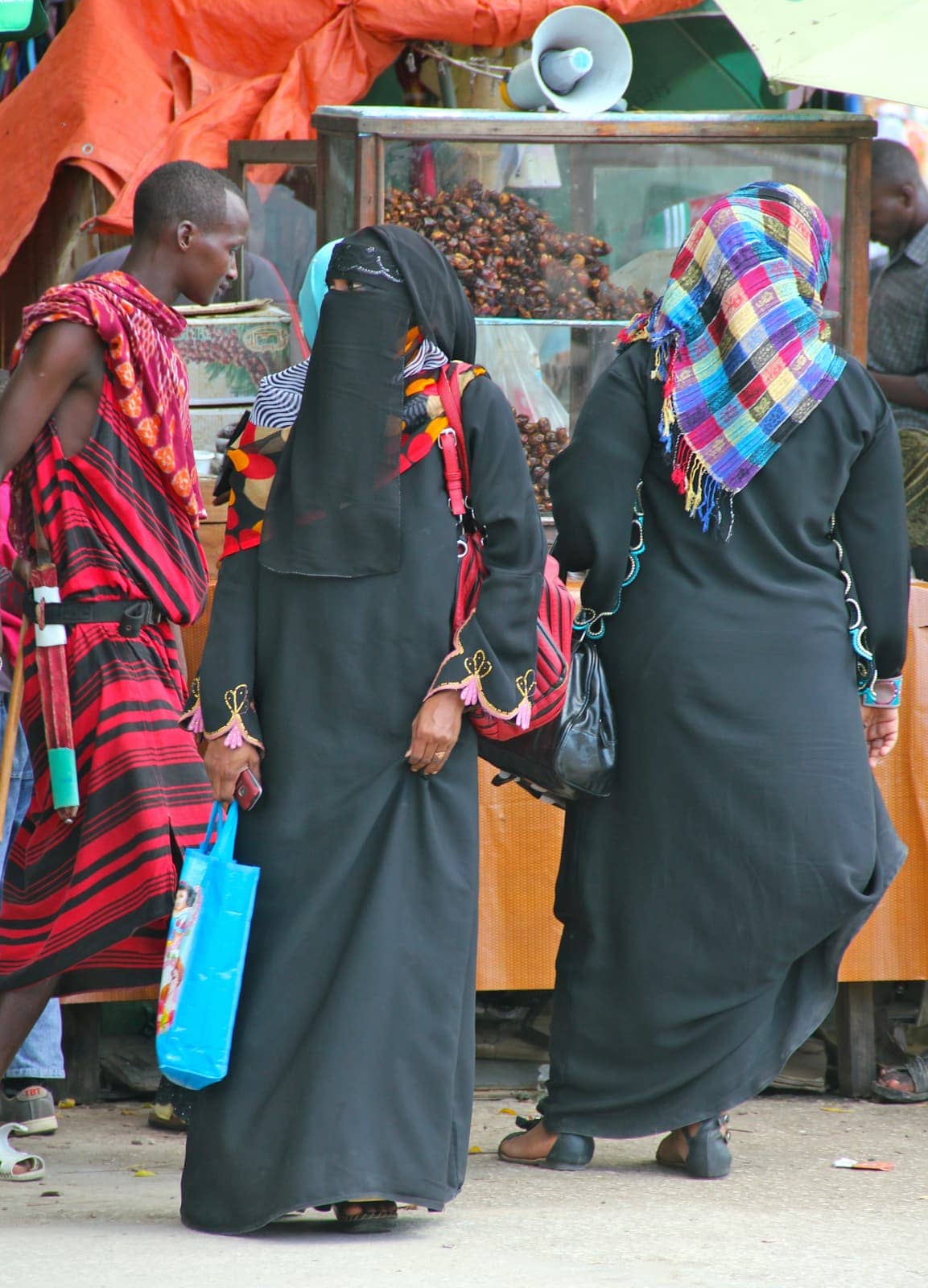 Ethnic women dressed in full body black dress