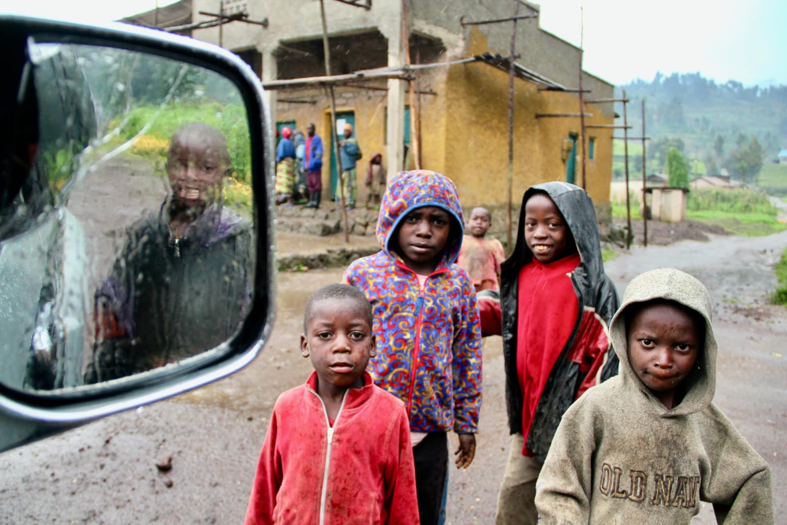 Group of African children standing in the rain