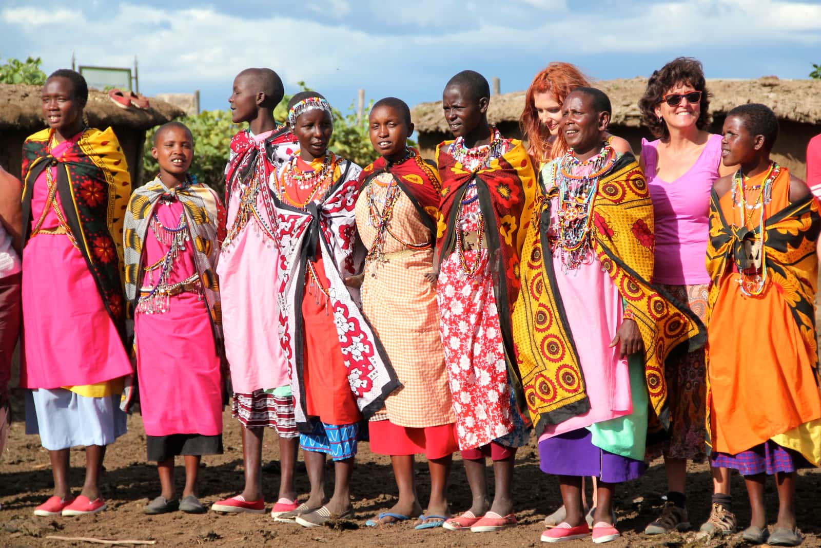 Group of Africans in colourful dresses standing together