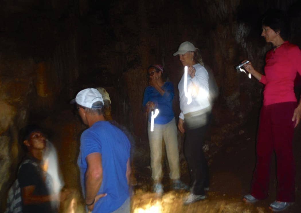 Group of people exploring cave