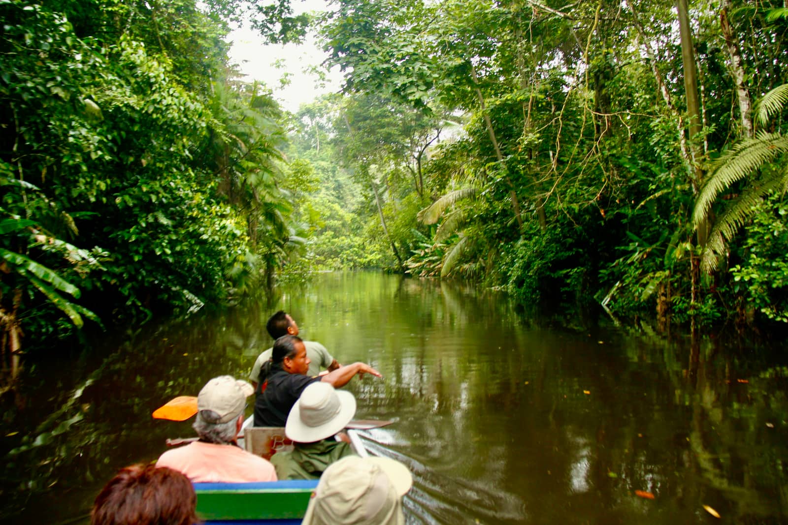 Group of people in boat on river in Amazon