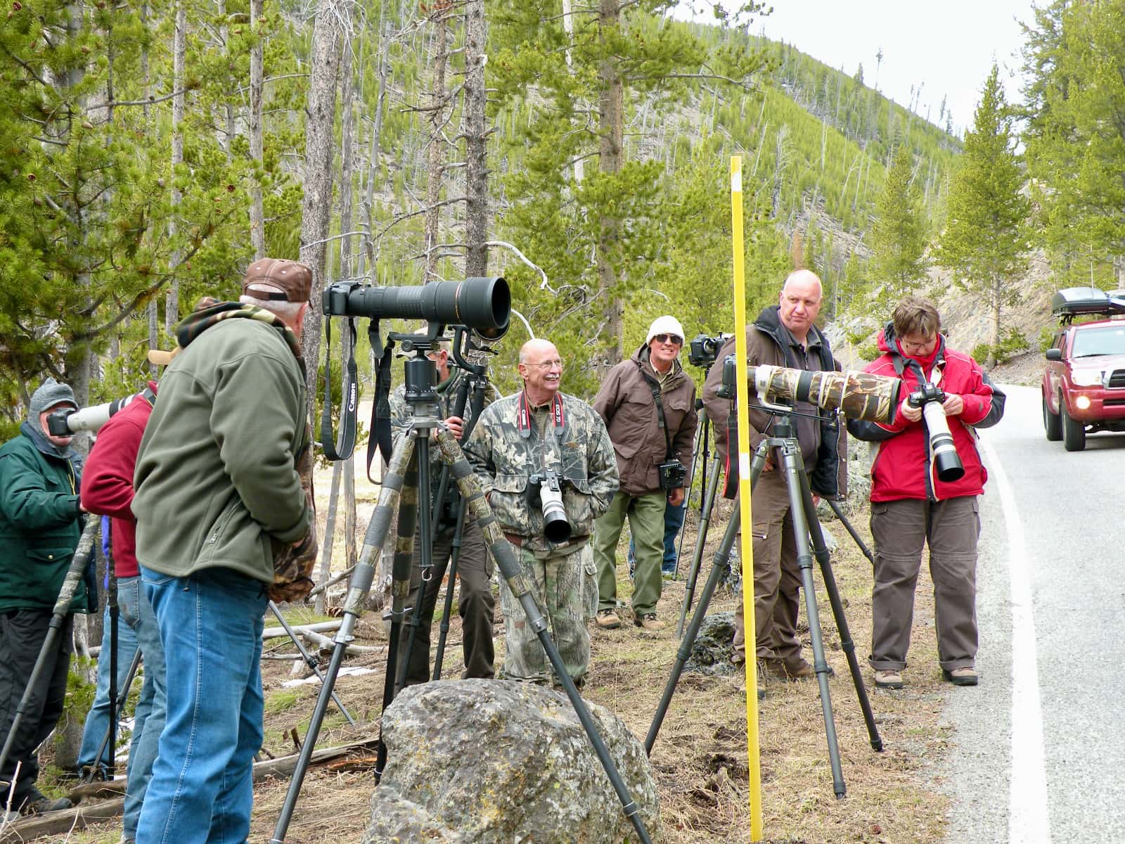 Group of photographers standing on roadside