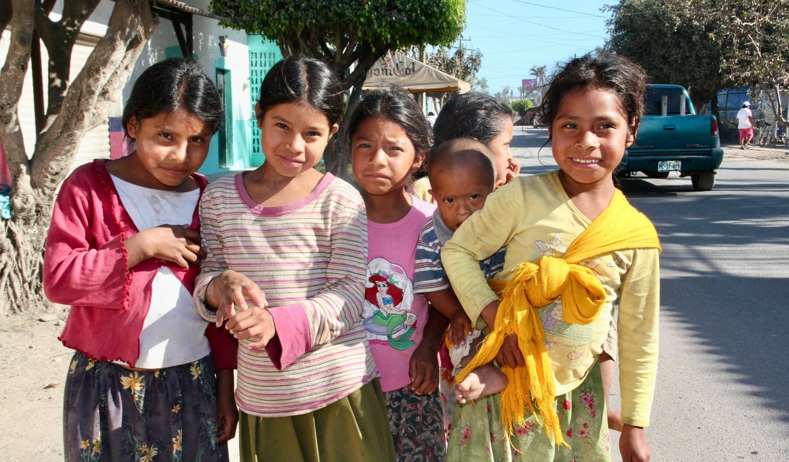 Group of young children posing for camera