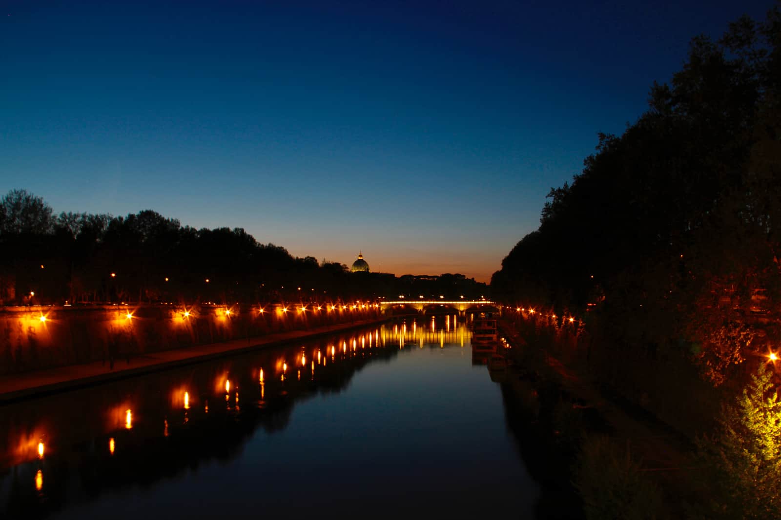 Large waterway illuminated by light