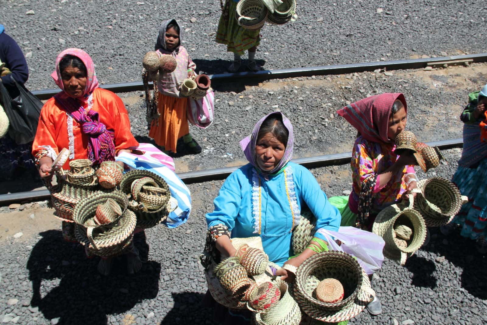 Local woman selling hand woven textiles