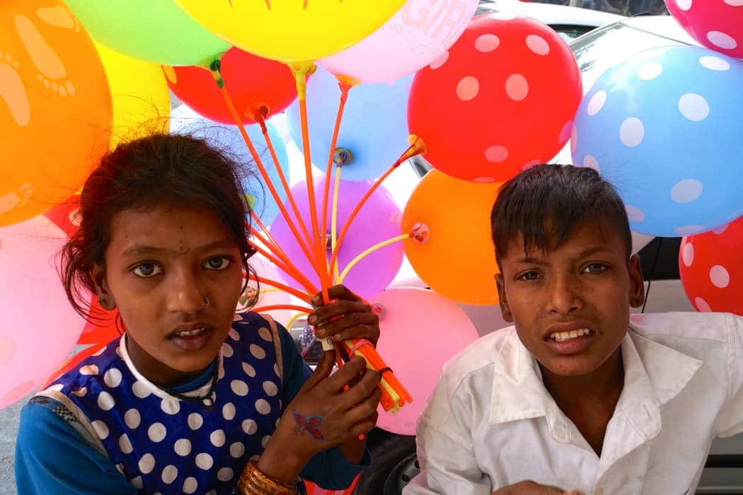 Man and woman selling balloons