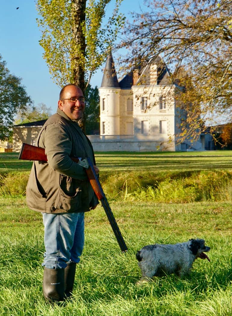 Man bird hunting with dog