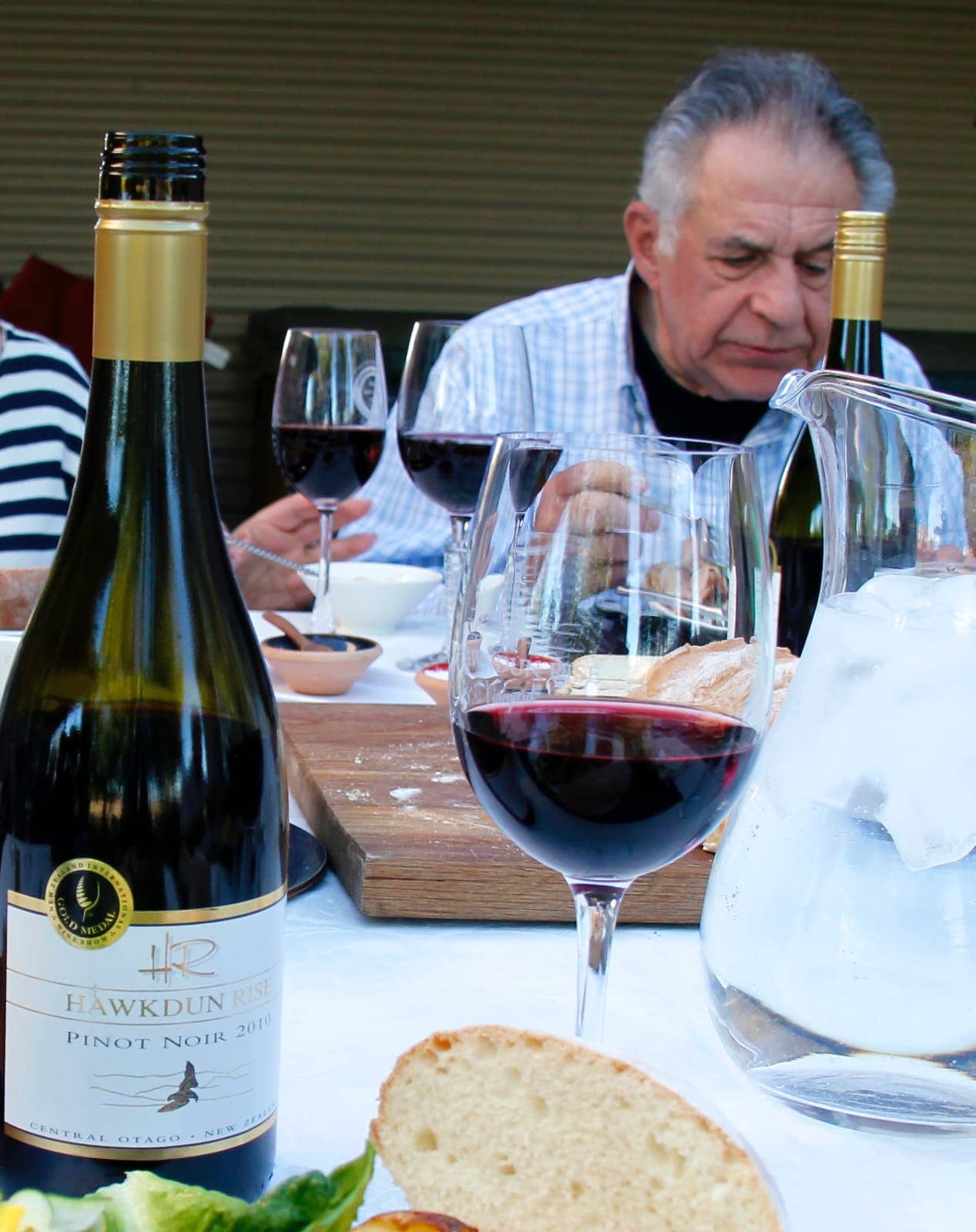 Man enjoying meal with red wine