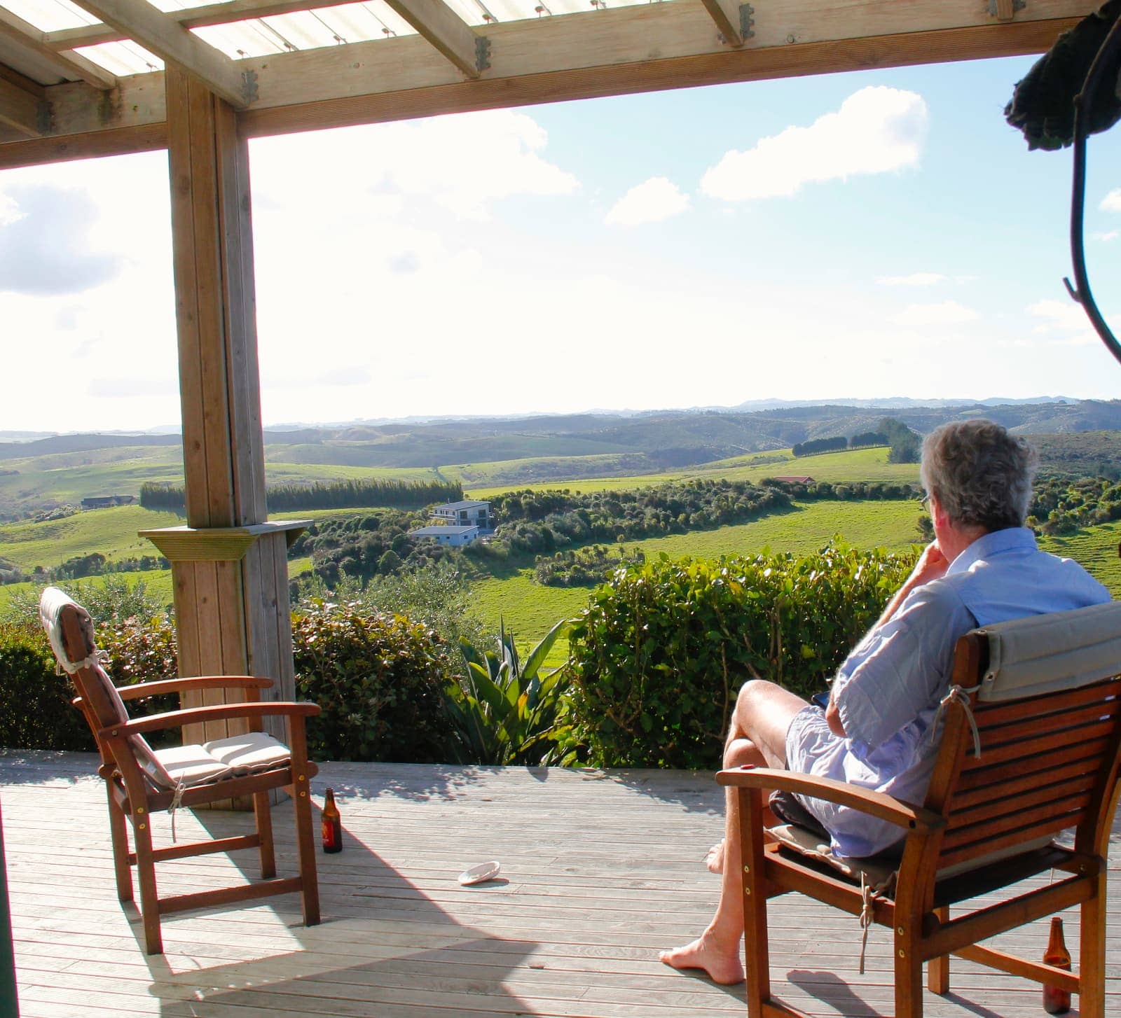 Man enjoying views of green rolling hills