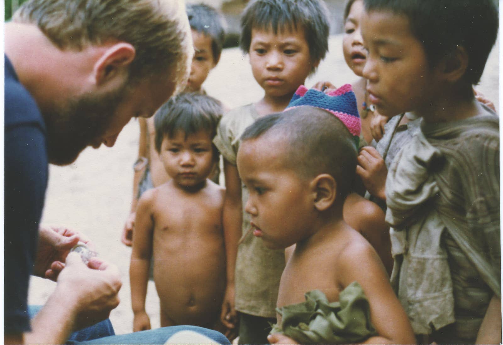 Man interacting with local Thai children