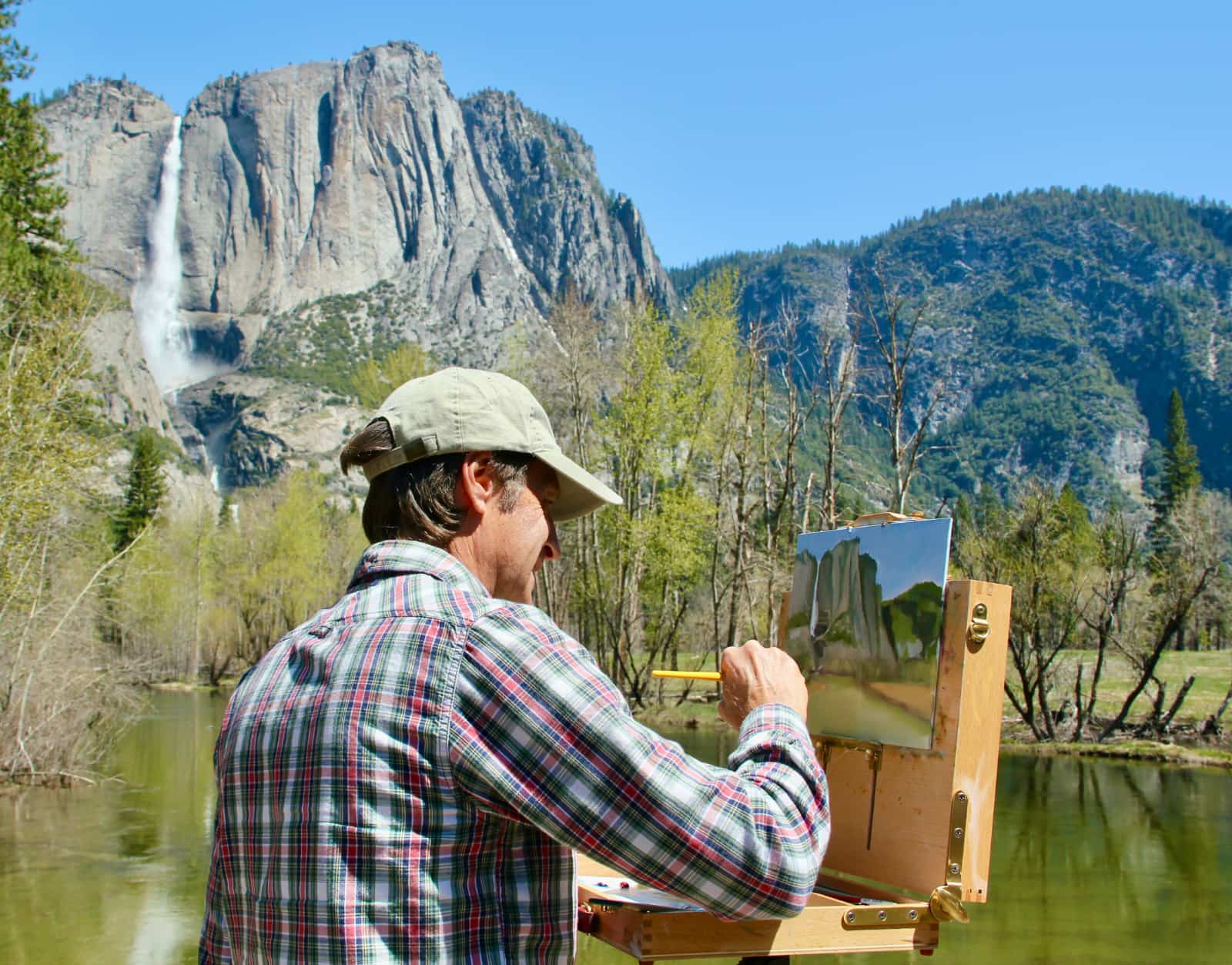 Man painting local scenery