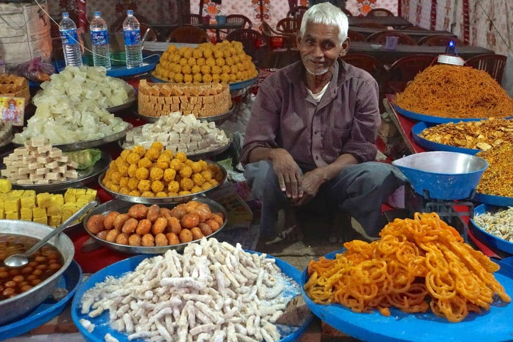 Man sitting with various food items