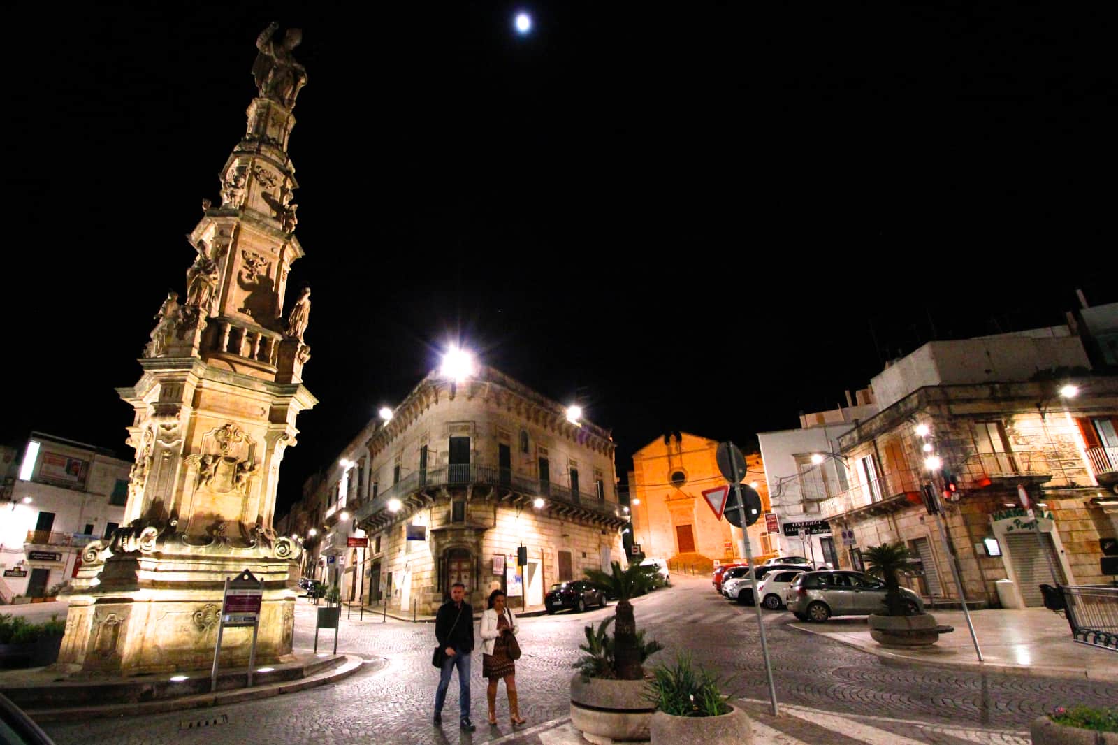 Old buildings and cobble stone roadway at night