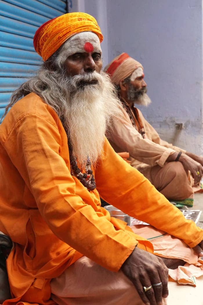 Old man with long beard dressed in orange