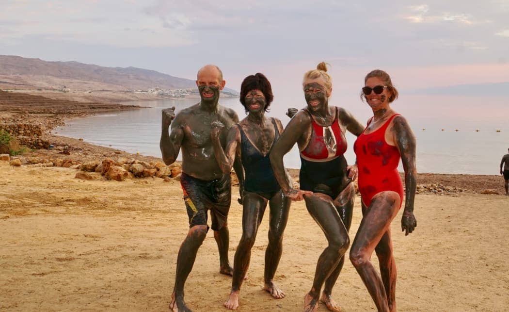 People posing after mudbath Jordan