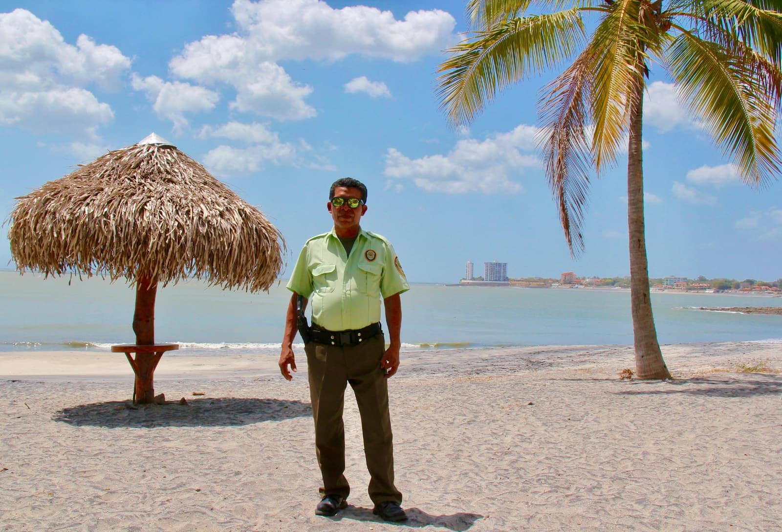 Police officer in lime green shirt posing for camera