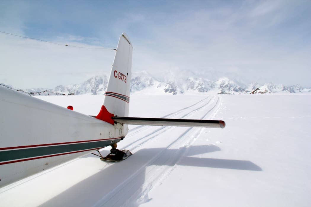 Rear view of plane taking off of glacier