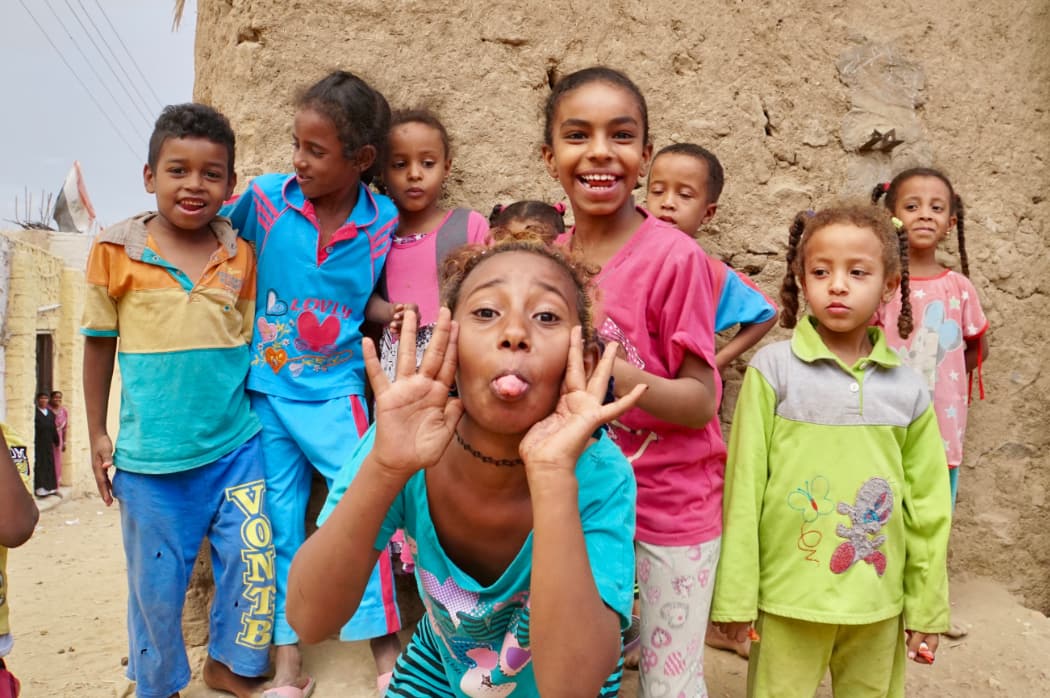 Group of children in colourful shirts