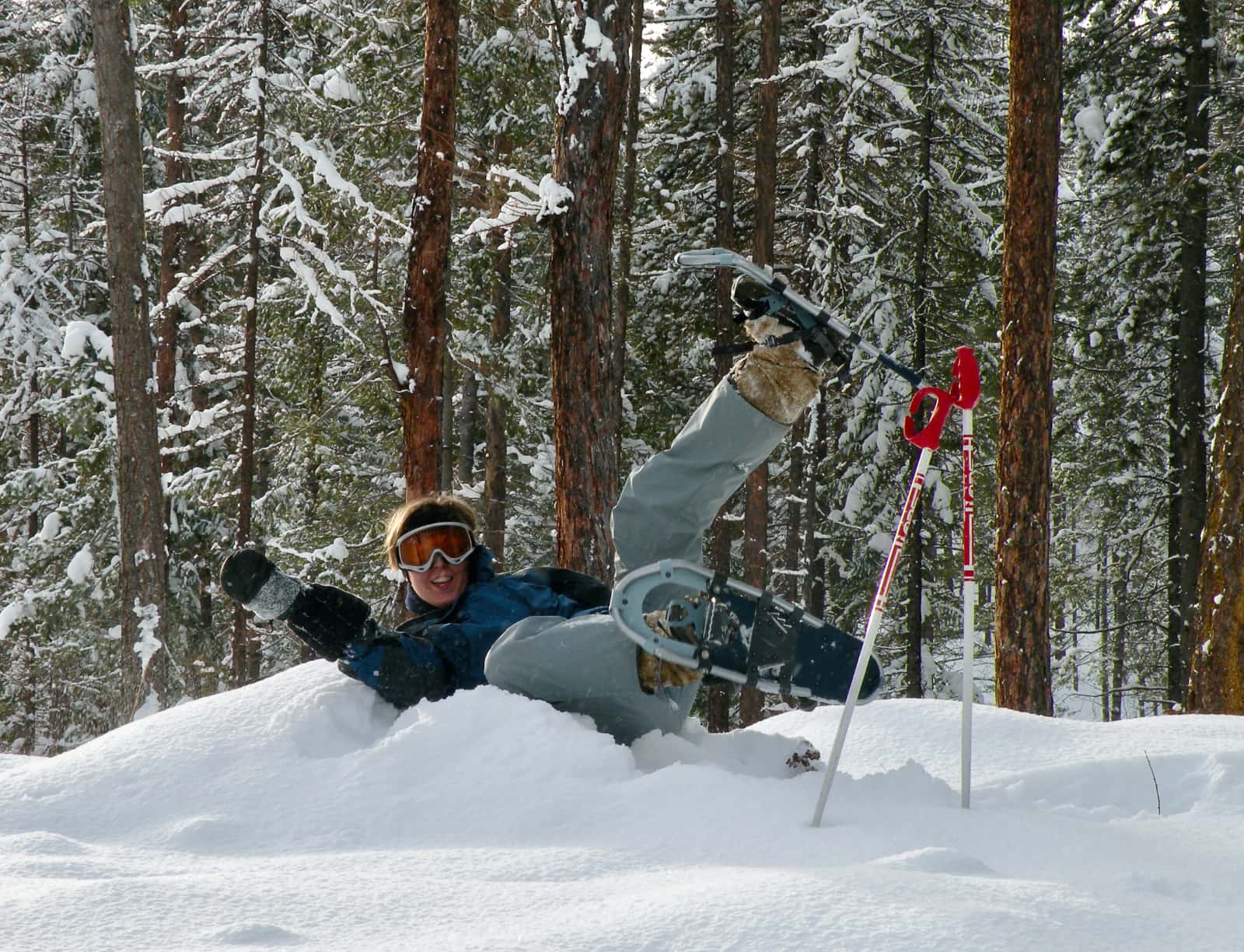 Skier laying in deep snow