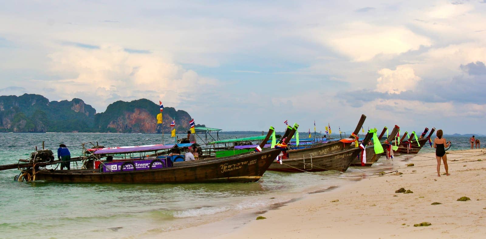 Thai long boats parked on beach