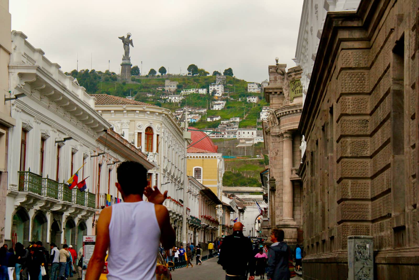 People walking down street in Quito