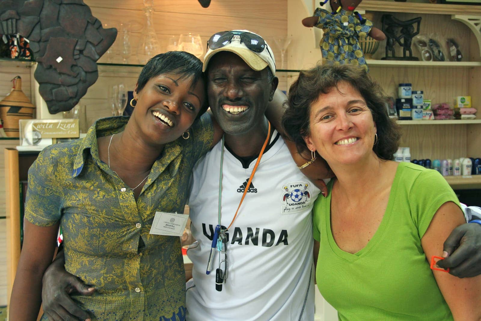 Two women and one man smiling for camera