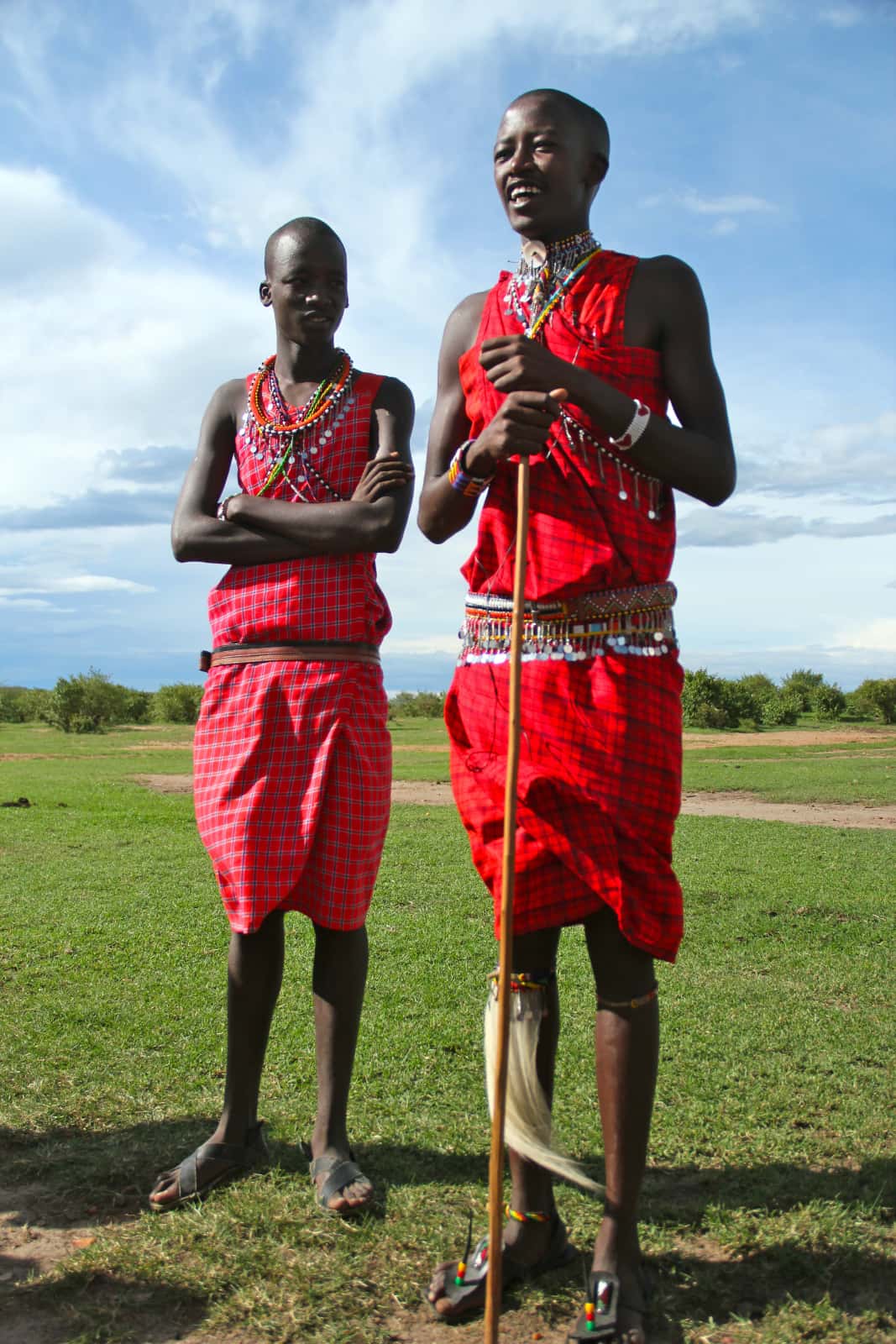 Two young Africans standing in native dress