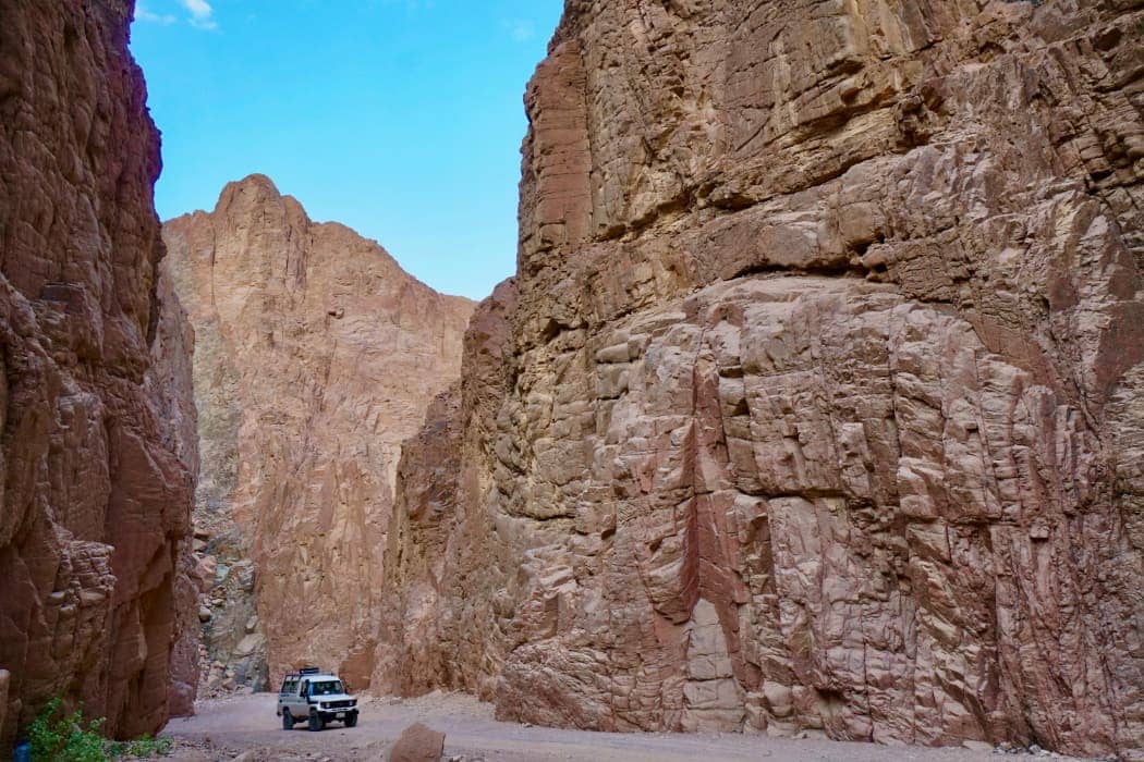 Vehicle driving in deep canyon