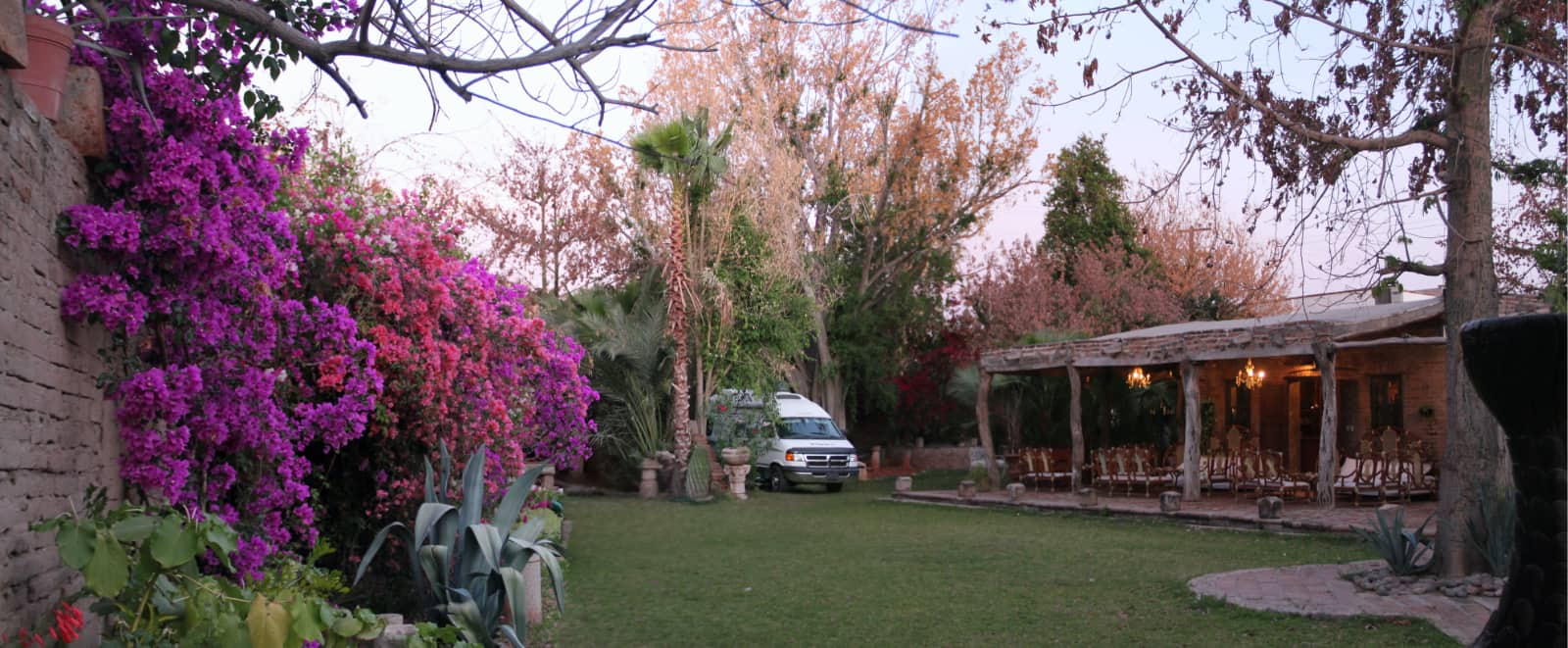 White camper van parked next to house