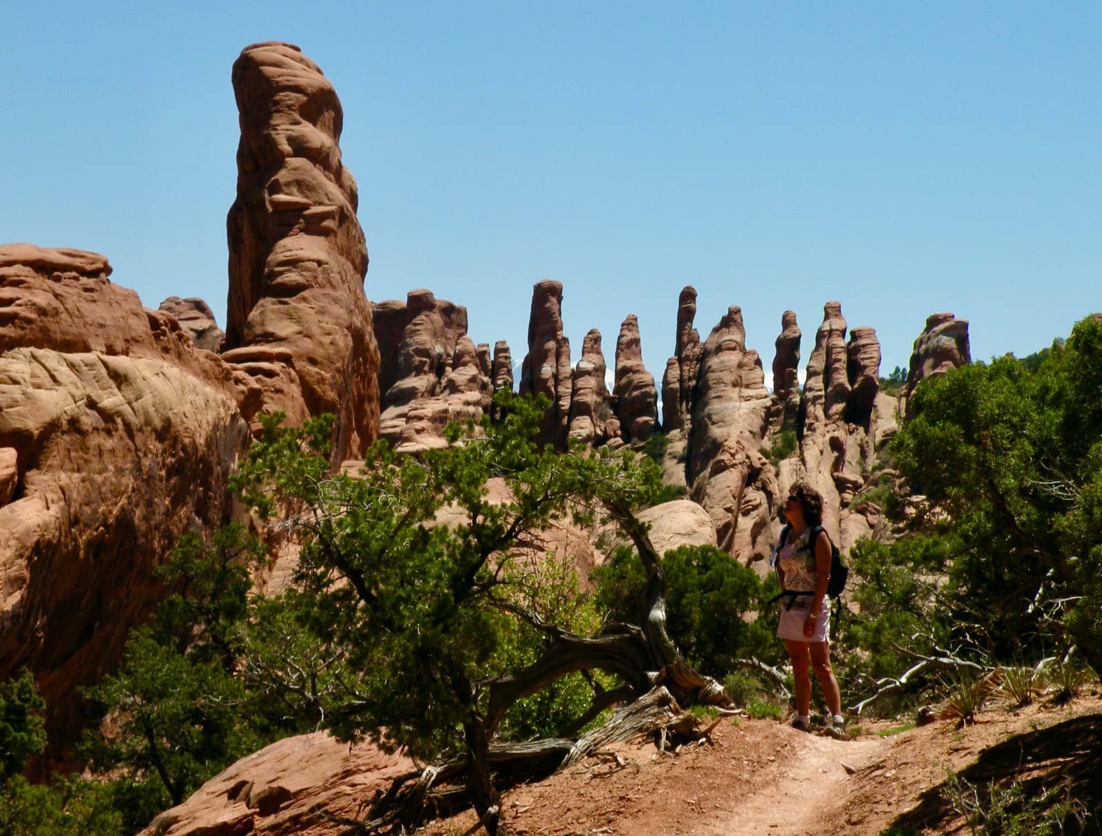Woman admiring tall and narrow rock formations