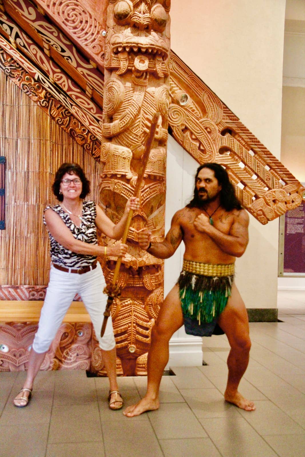 Woman and man posing at cultural ceremony