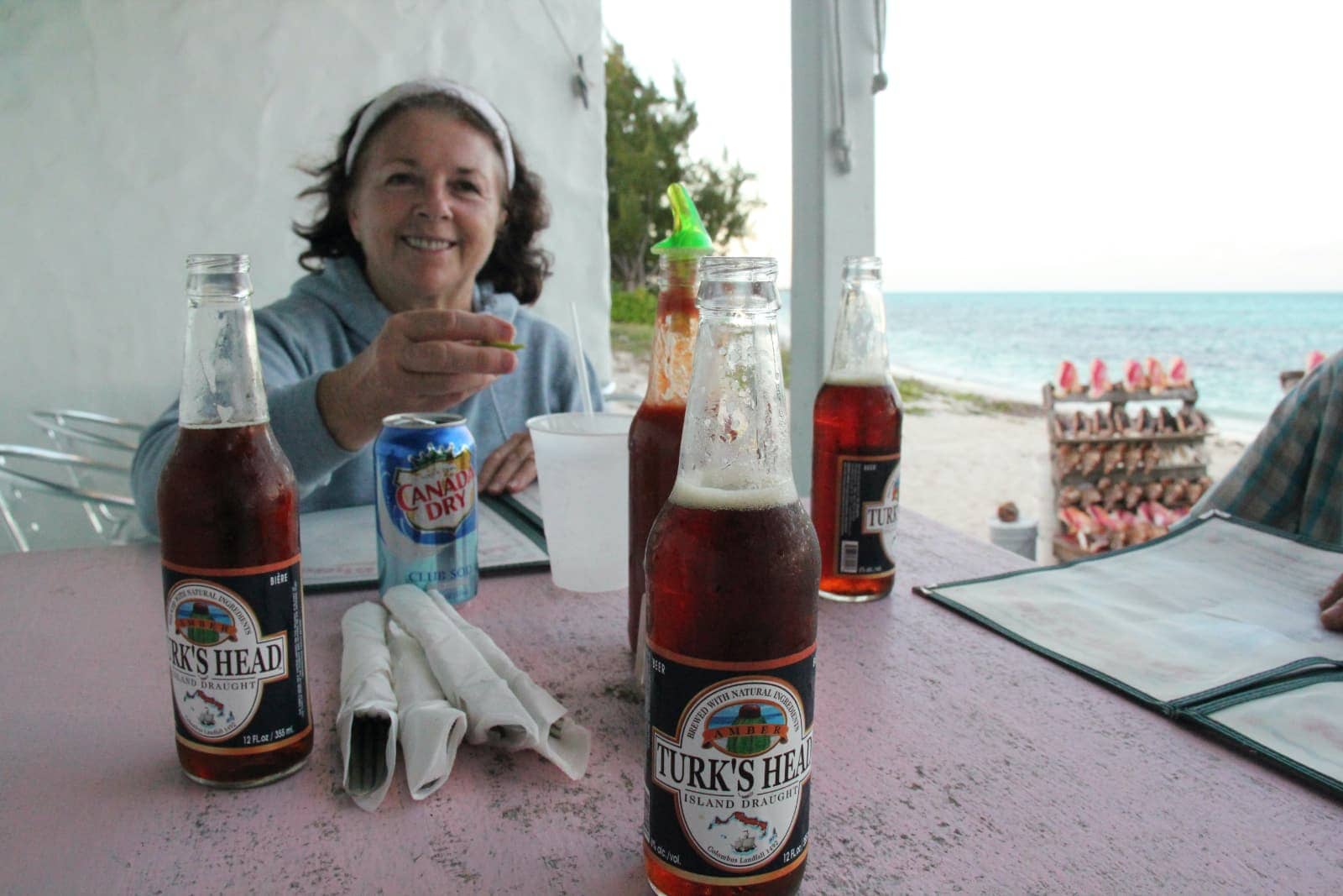 Woman enjoying local beverages at restaurant