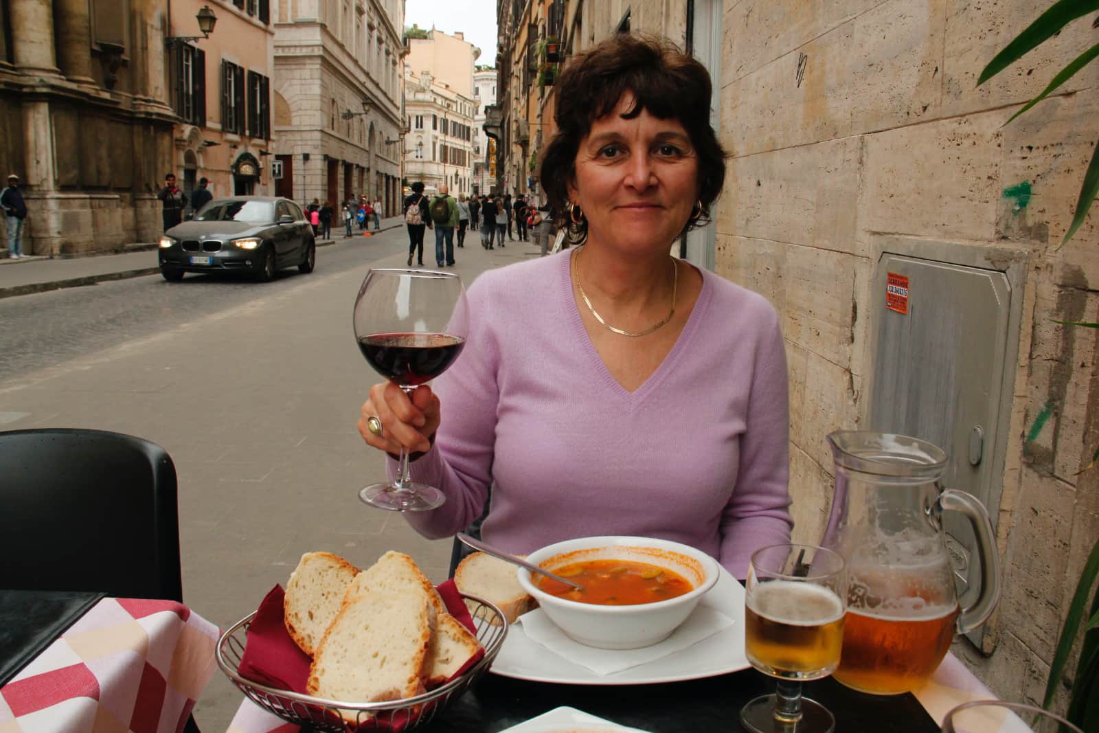 Woman enjoying meal of bread and soup