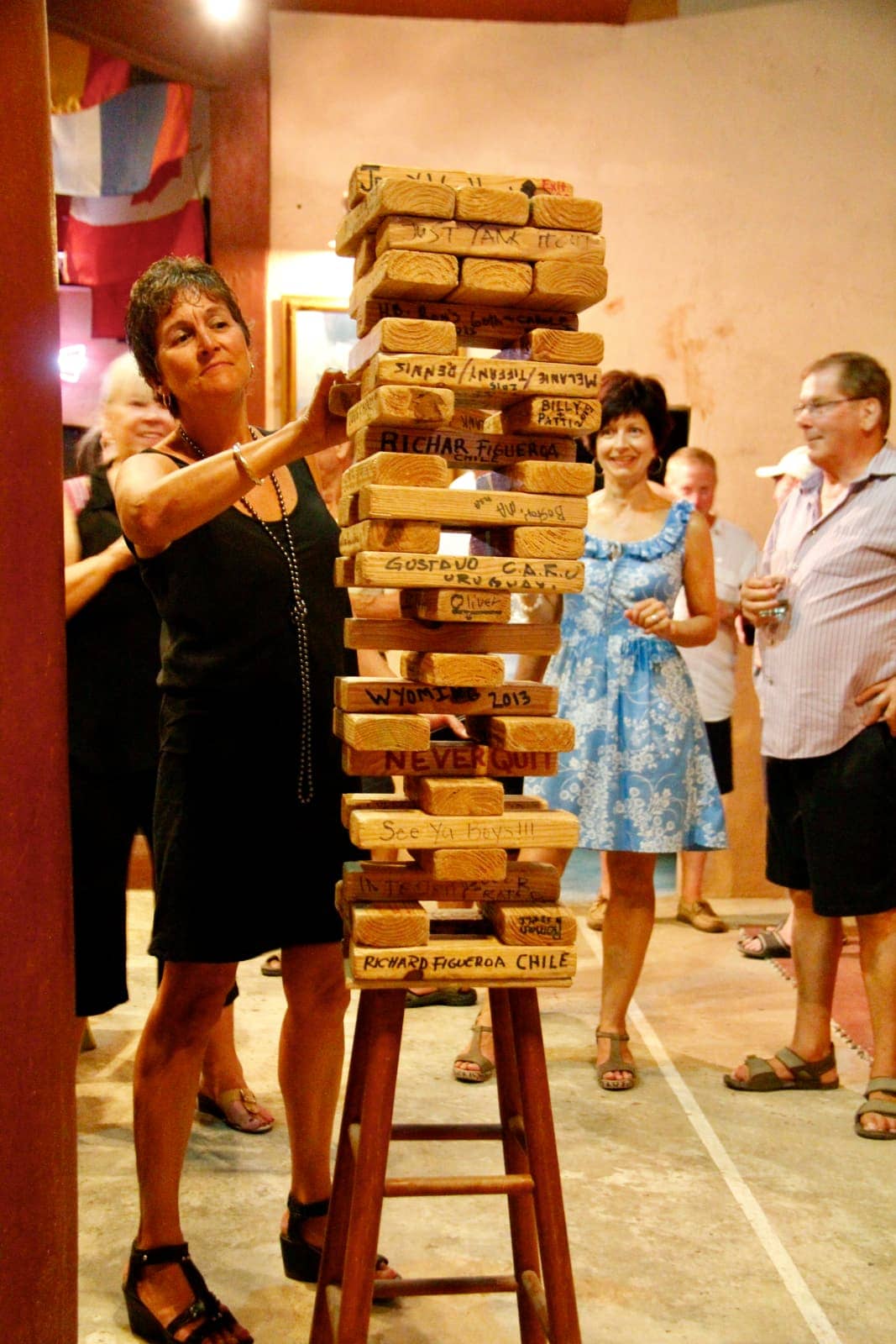 Woman playing with oversized Jenga puzzle