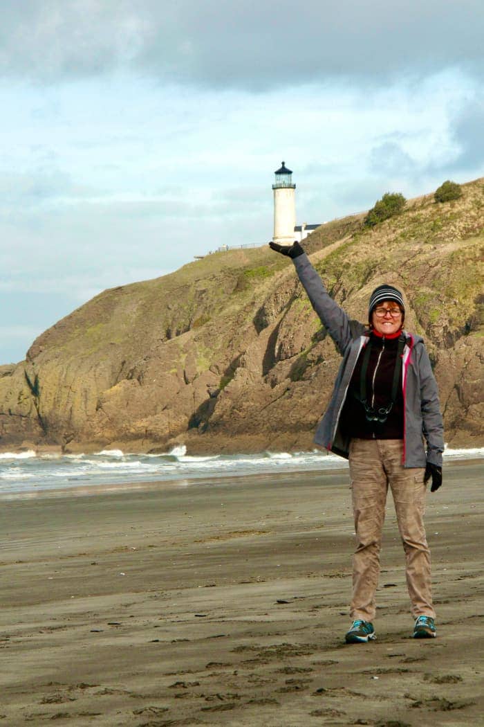 Woman pretending to hold lighthouse