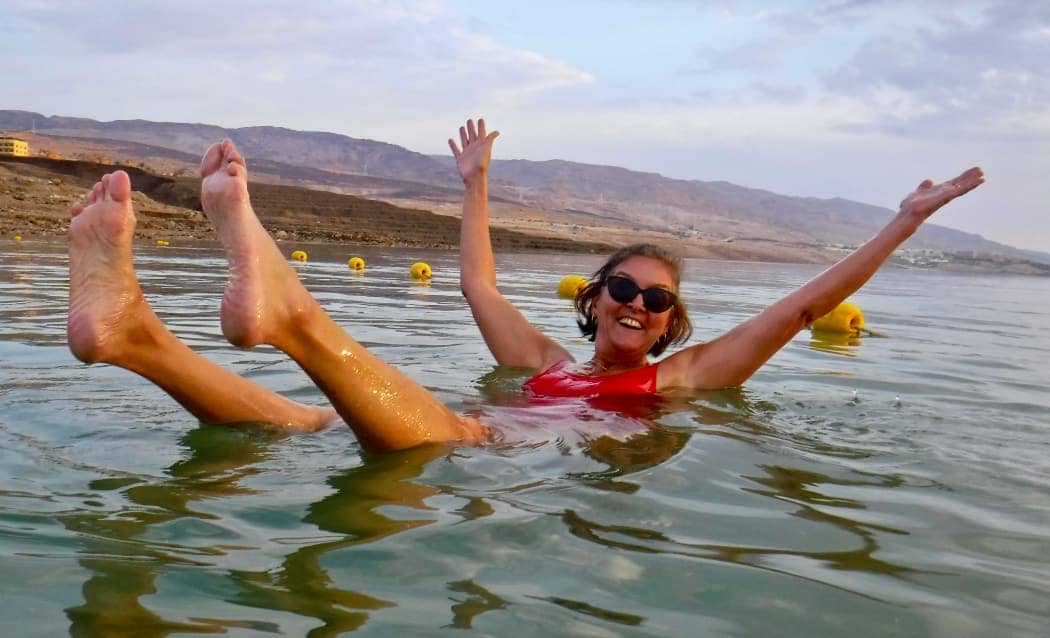 Woman smiling and floating in water Jordan