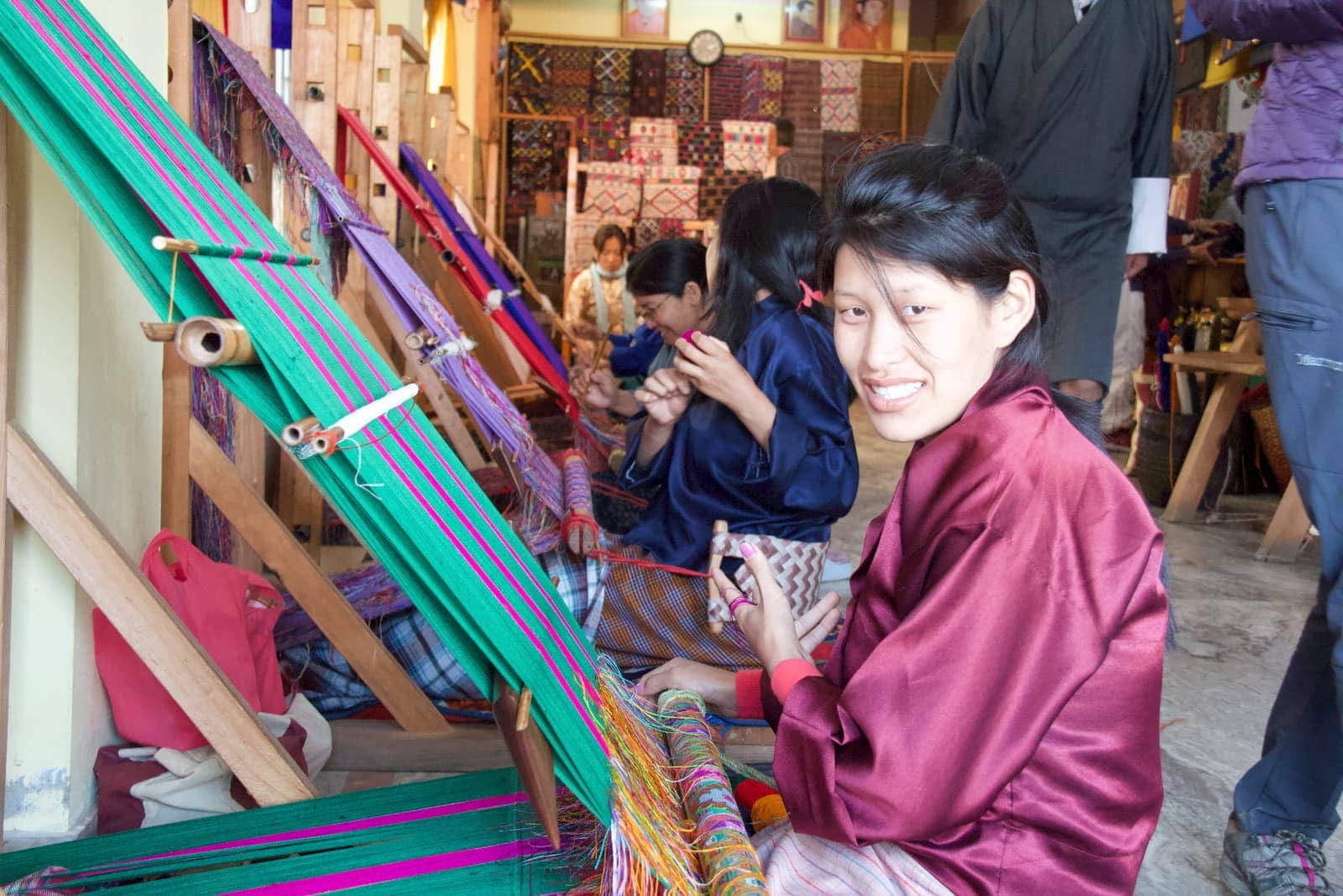 Woman smiling while working with textiles