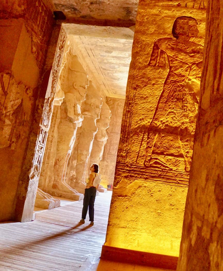 Woman wandering through Egyptian temple