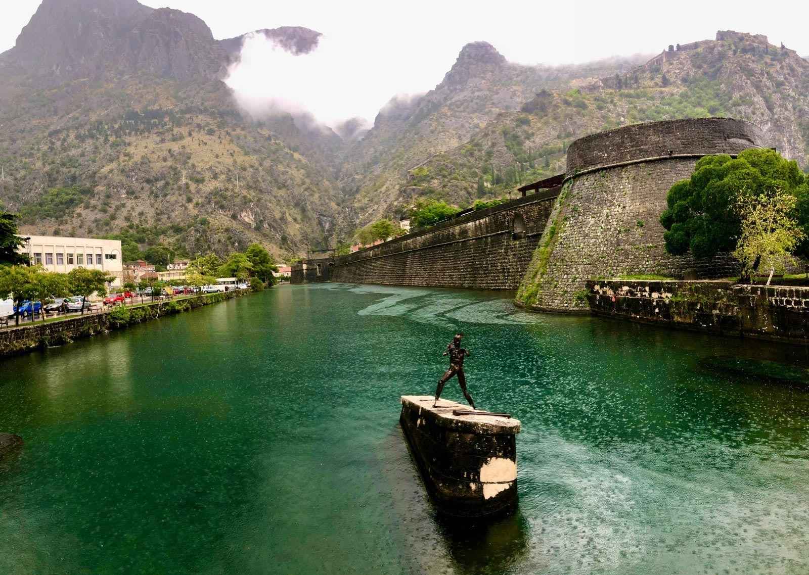 Statue in moat in Montenegro