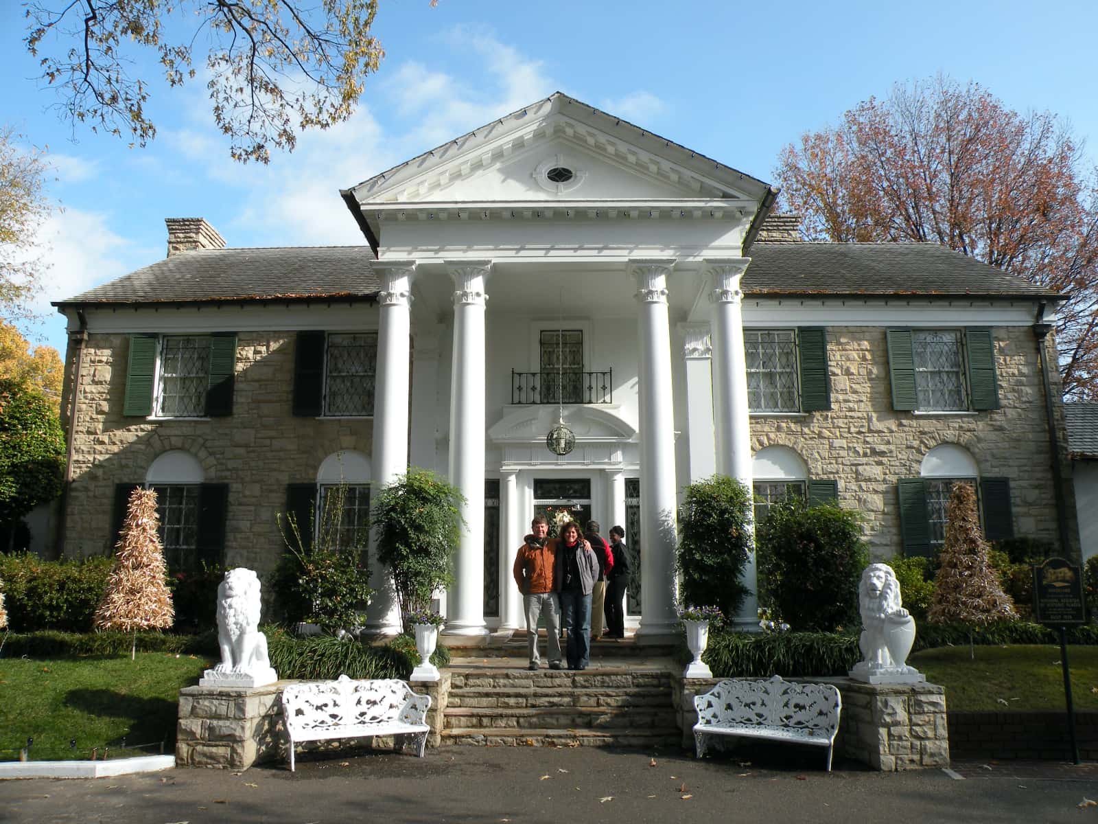Man and woman standing outside Graceland building